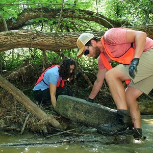 People engaged in stream cleanup in Curry's Fork Watershed.